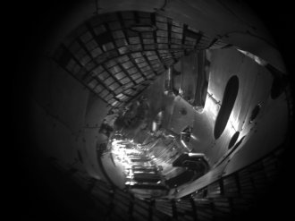 For comparison: View into the empty plasma vessel, recorded by a black-white-camera installed inside the plasma vessel. These pictures offer higher resolution and the camera is more light-sensitive than a colour camera.